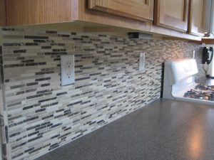 Staggered mosaic kitchen backsplash